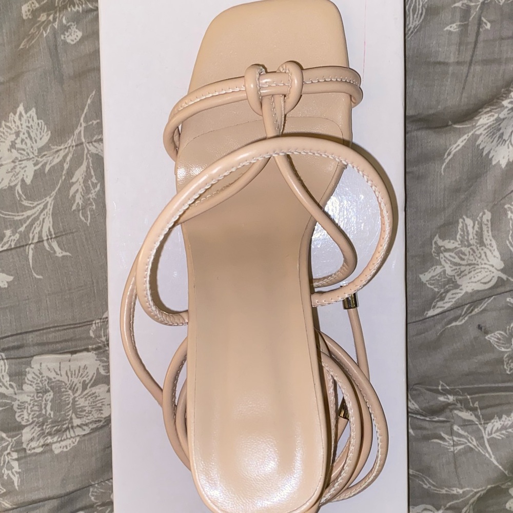 Brand new Nude strappy heels, with a clear tapered heel